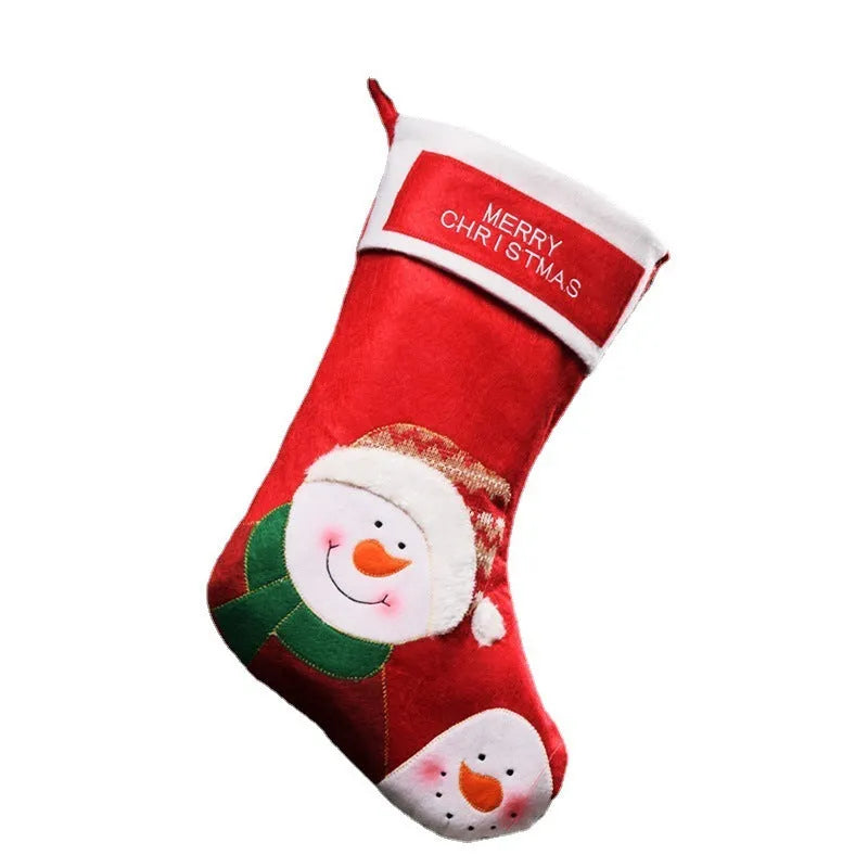 Christmas sock pendant decorations showing elk, Santa, and snowman motifs