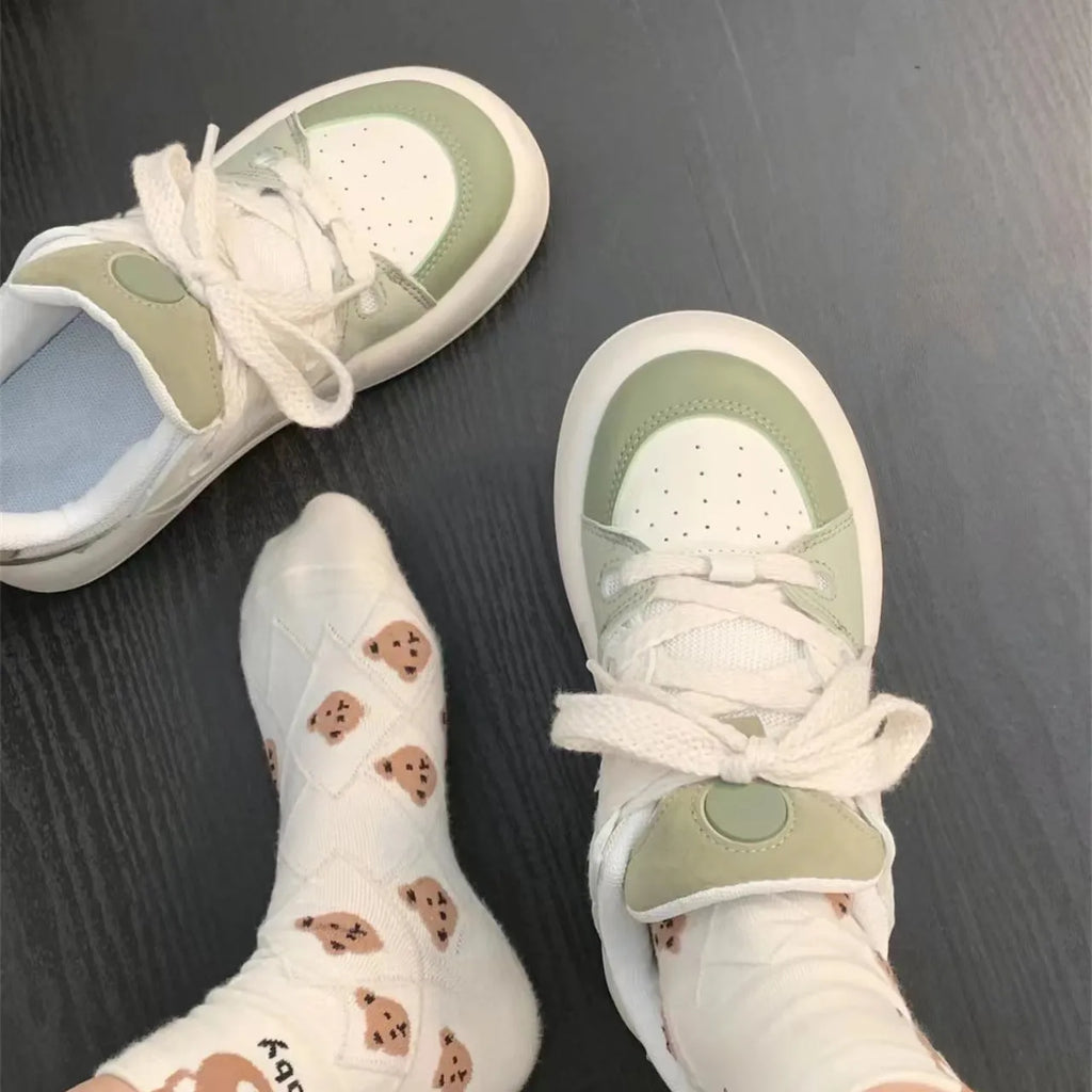 Green women's casual shoes with mesh upper, round toe, and flat heel design