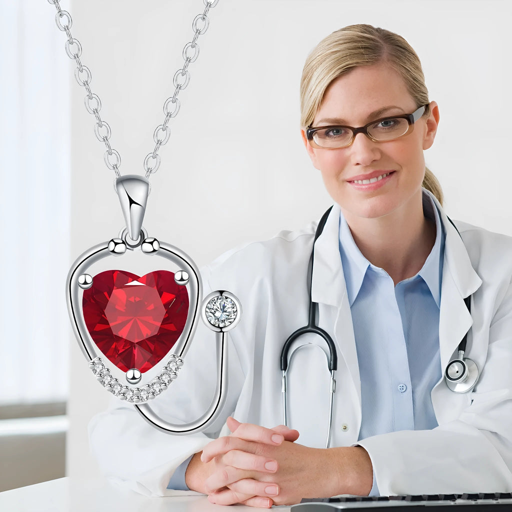 Women's copper necklace with stethoscope charm featuring wings and cross design in red diamond colour