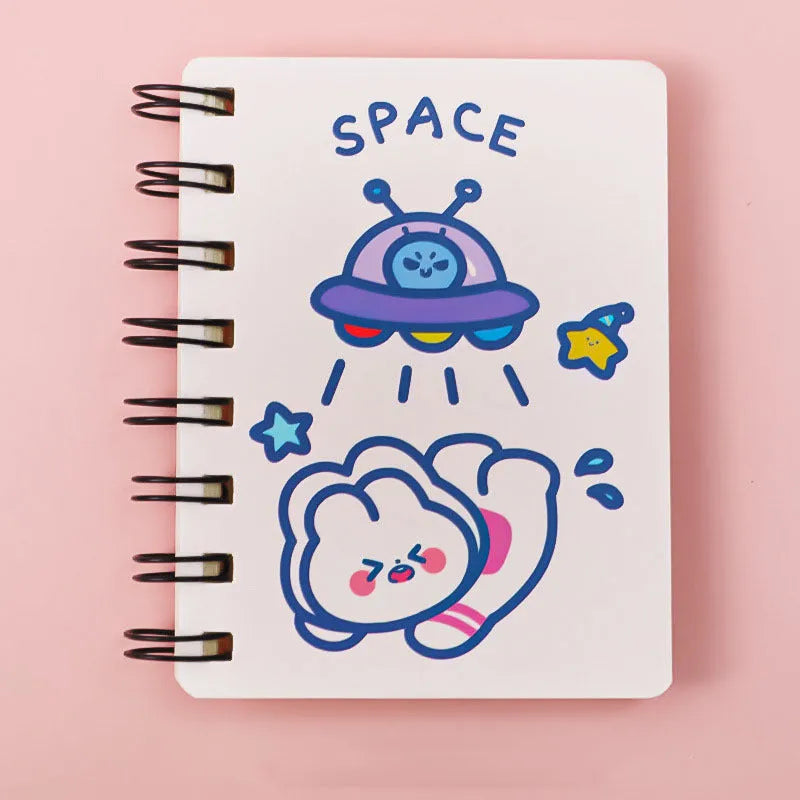 Astronaut-themed pocket notebook with flip closure showing 10.5 × 8 cm dimensions