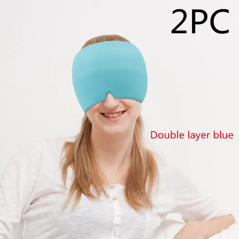 Black elastic cloth gel cold therapy eye mask for headache relief on grey background.
