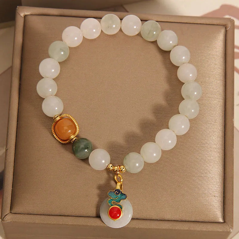 Women's ice jade bracelet with a pearl on the jade buckle.