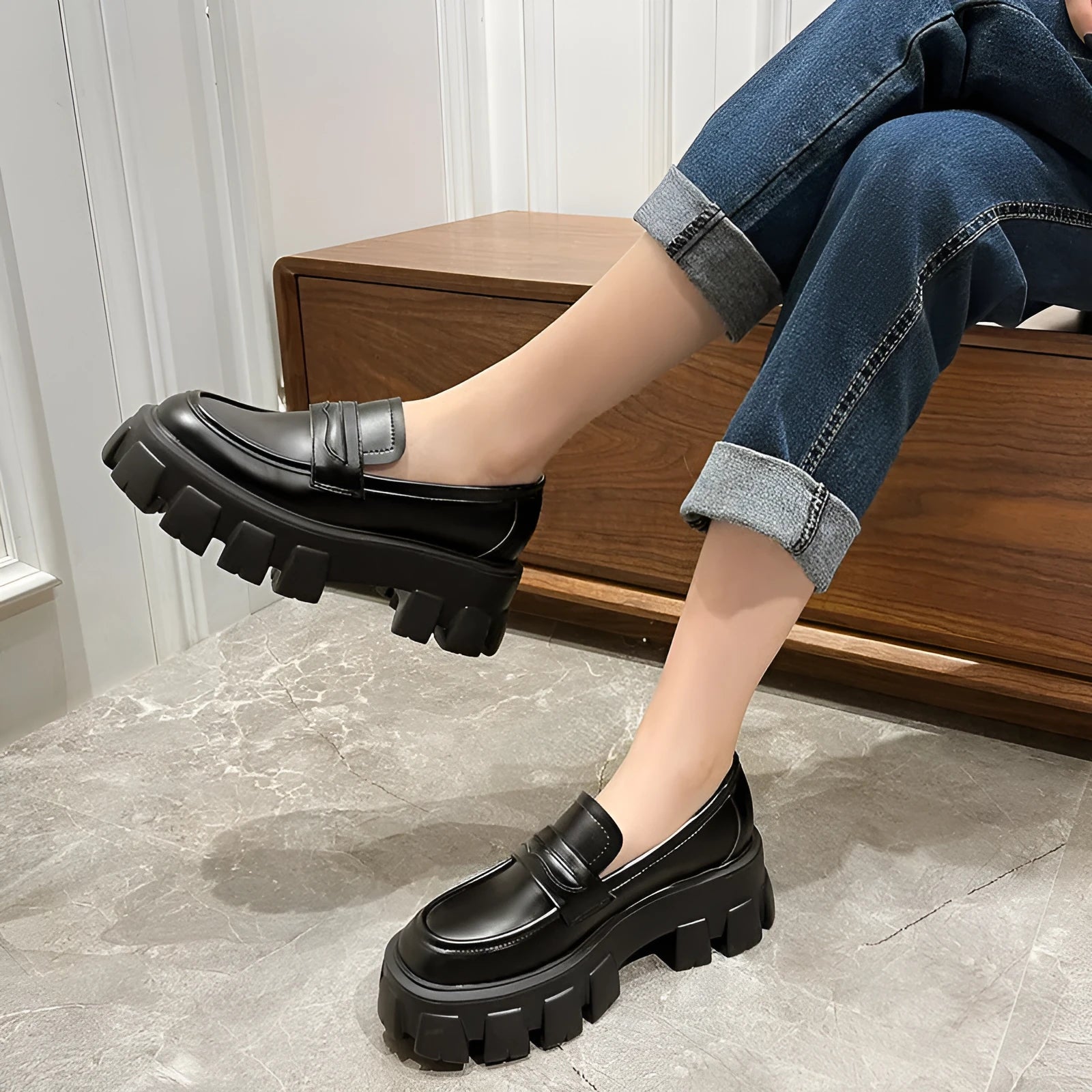 British style wide fit loafers in patent or matte leather with a rubber sole.