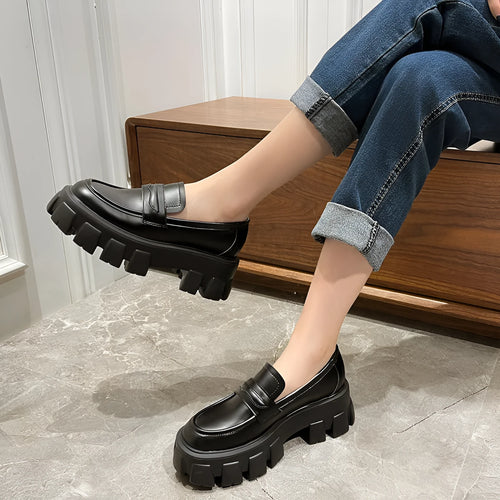 British style wide fit loafers in patent or matte leather with a rubber sole.