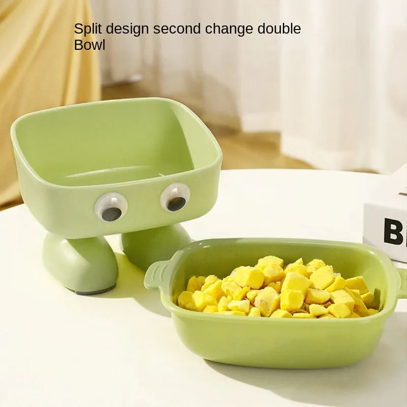 Green robot-shaped elevated cat bowl with tilted design and detachable inner component