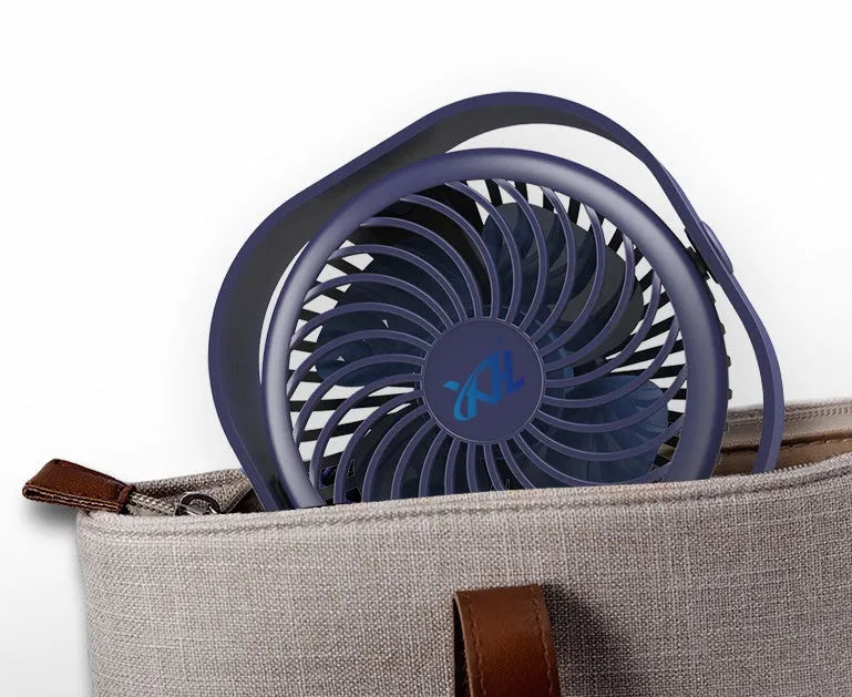 USB desk fan with rotating head in modern alarm clock style on a desk.