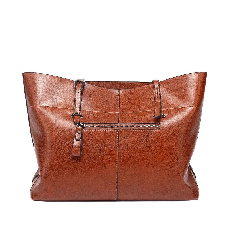 Cowhide leather cross-body handbag showing internal compartments and mobile phone pocket