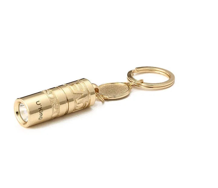 Gold zinc alloy waterproof LED flashlight attached to keychain with compact portable design