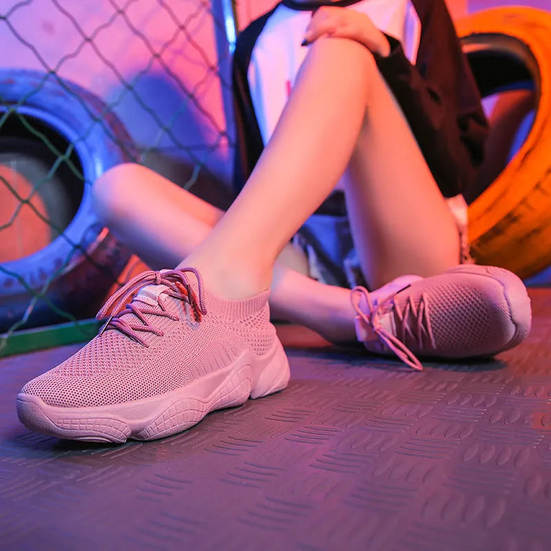 Women's white thick-soled casual sports shoes with woven upper and front strap.