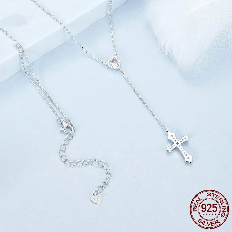 Simple sterling silver V-neck cross pendant necklace on an O-ring chain, colour BSN384.