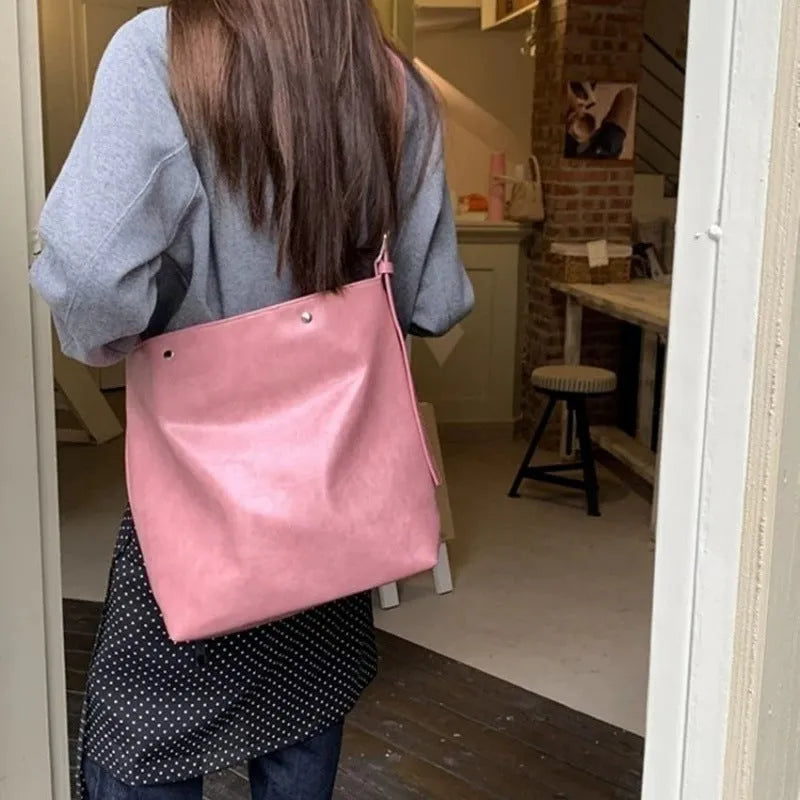Corduroy one-shoulder commuter bag in pink with PU-lined interior