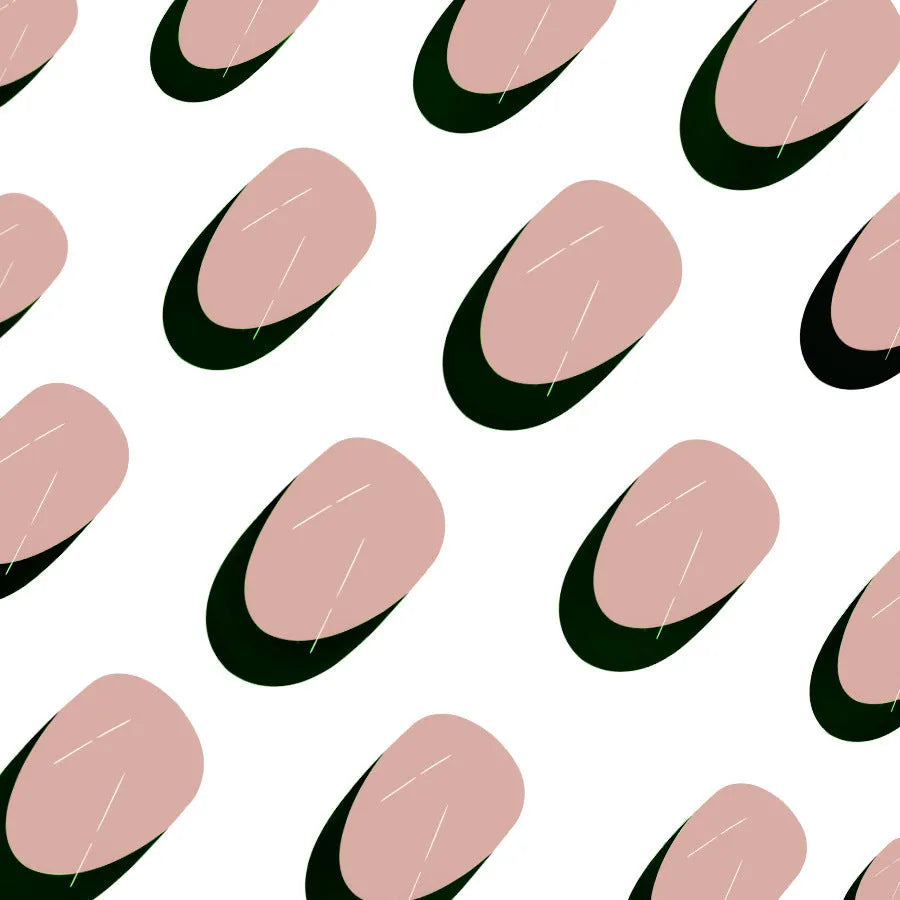 Short almond shaped false nails with black French tips, set of 24 pieces laid out.