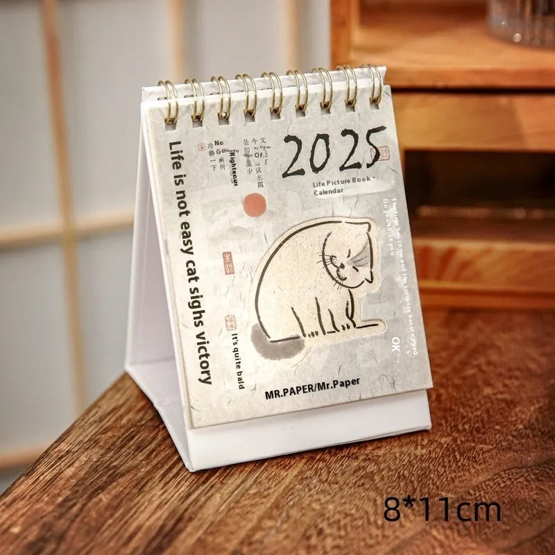 Mini coffee-themed desk calendar for 2025 showing daily pages and simple modern design