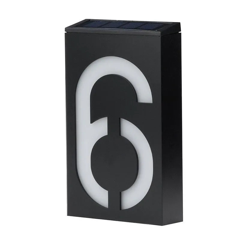 Solar-powered white LED house number light mounted on an outdoor wall