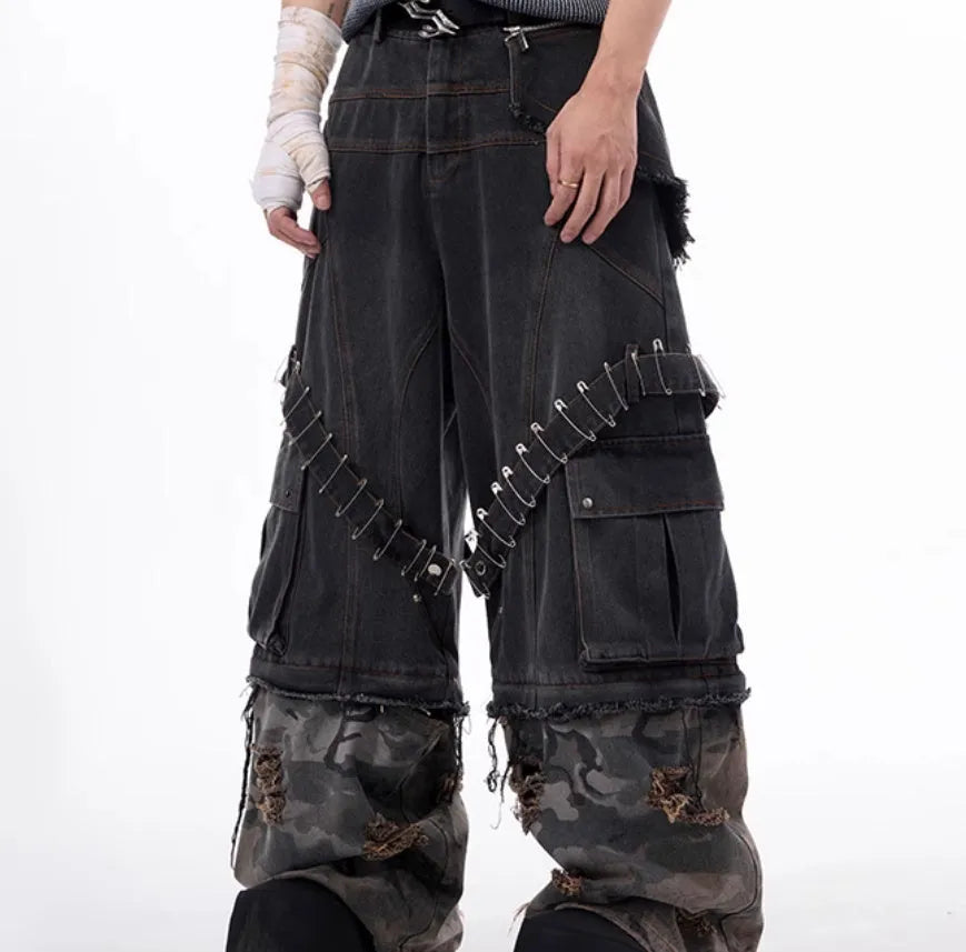 Men's grey cotton jeans with a camouflage splicing pattern, pin accents, and ribbon trim details.