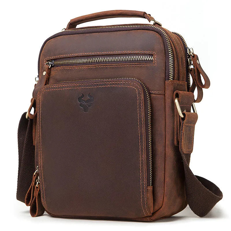 Men's brown crazy horse leather crossbody bag with sewing line detail and single shoulder strap.