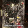DIY snowy landscape Christmas night light kit with LED lights and gift bag on a desktop