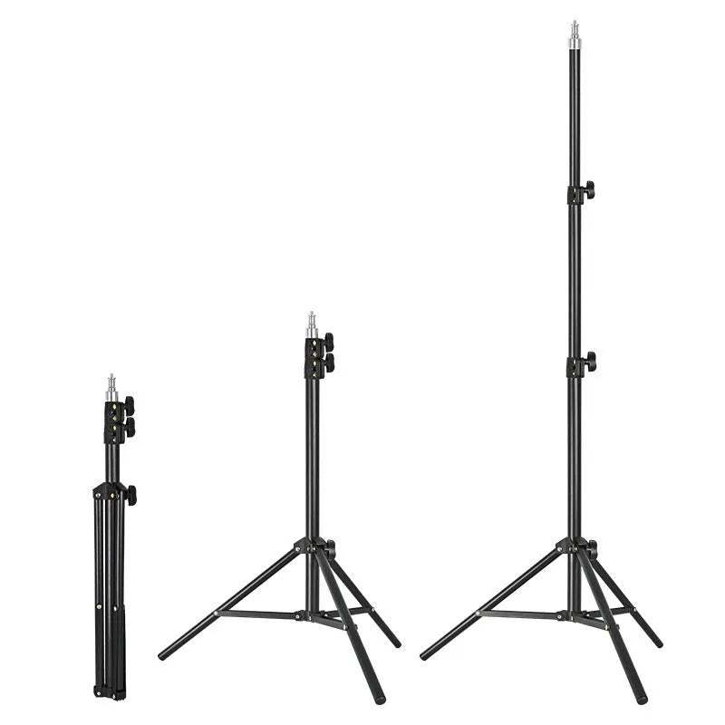 Frosted finish tripod light stand with mobile phone holder mounted, showing carbon steel construction and adjustable legs