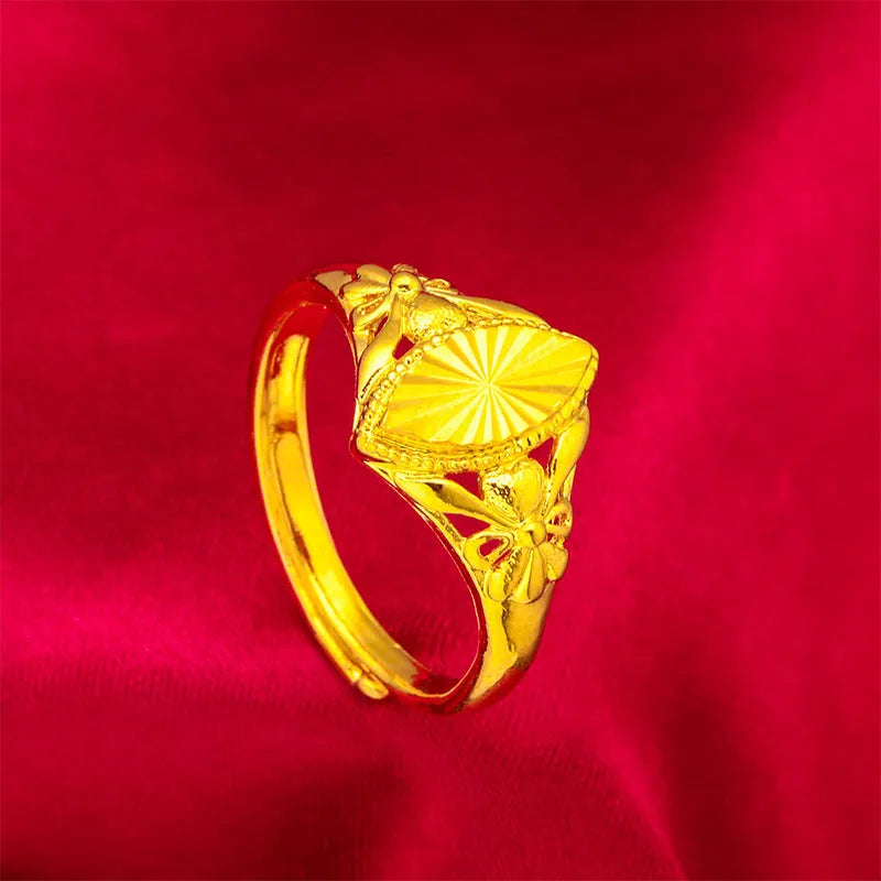 Gold geometric ring with open diamond floral pattern and textured surface
