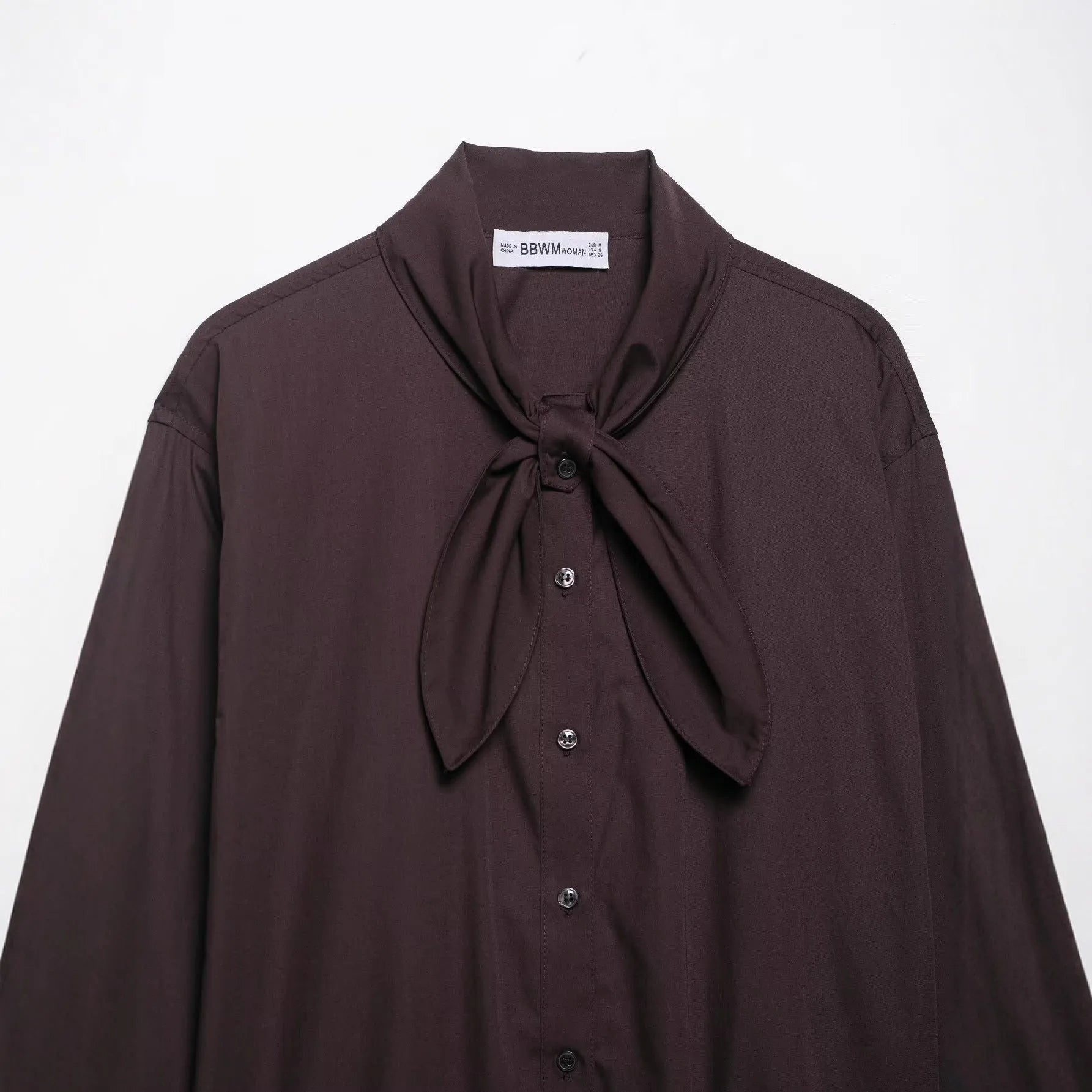 Brown women's cardigan-style shirt with long sleeves and a built-in bow tie scarf detail