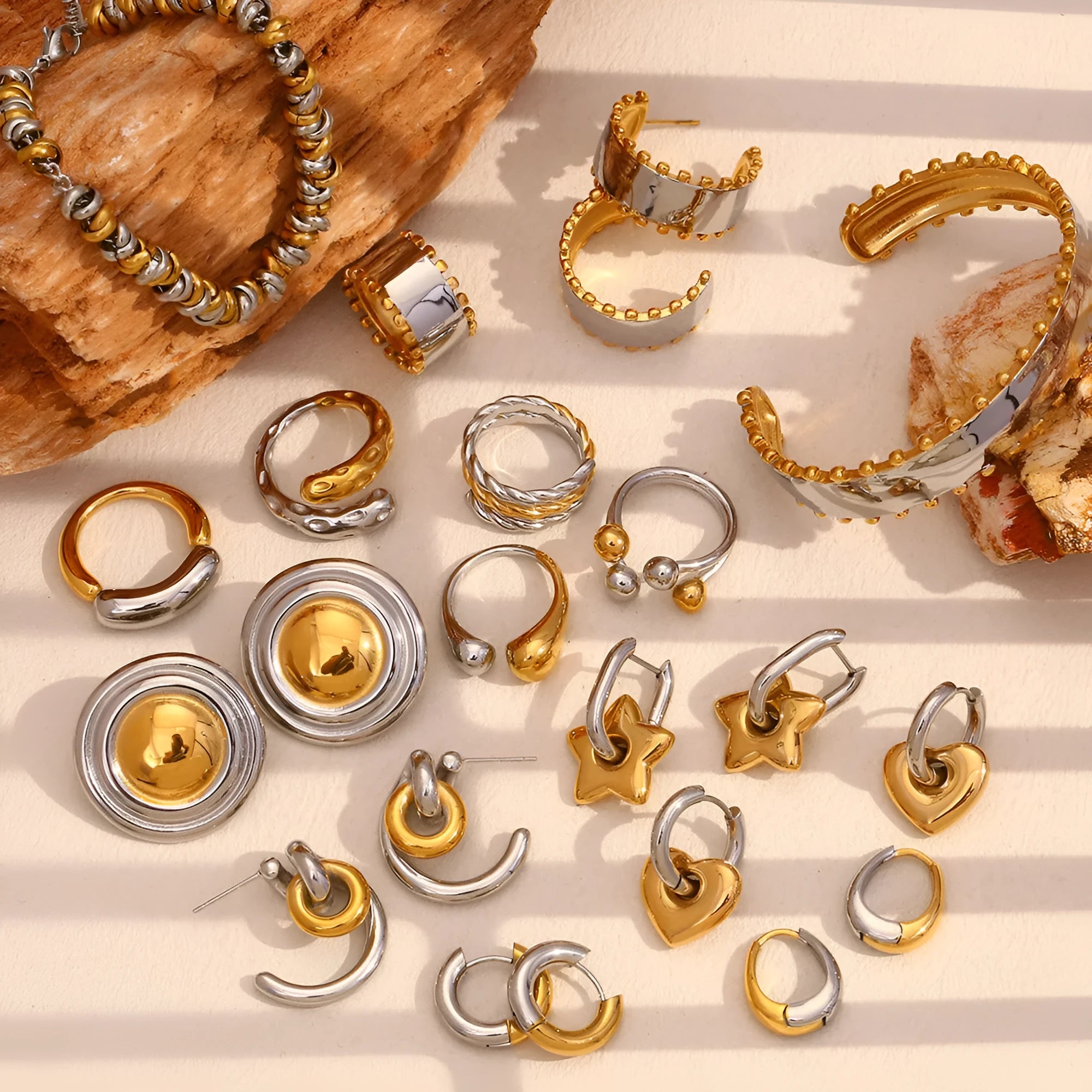 Gold electroplated geometric jewellery set with earrings, bracelet, and necklace on stainless steel