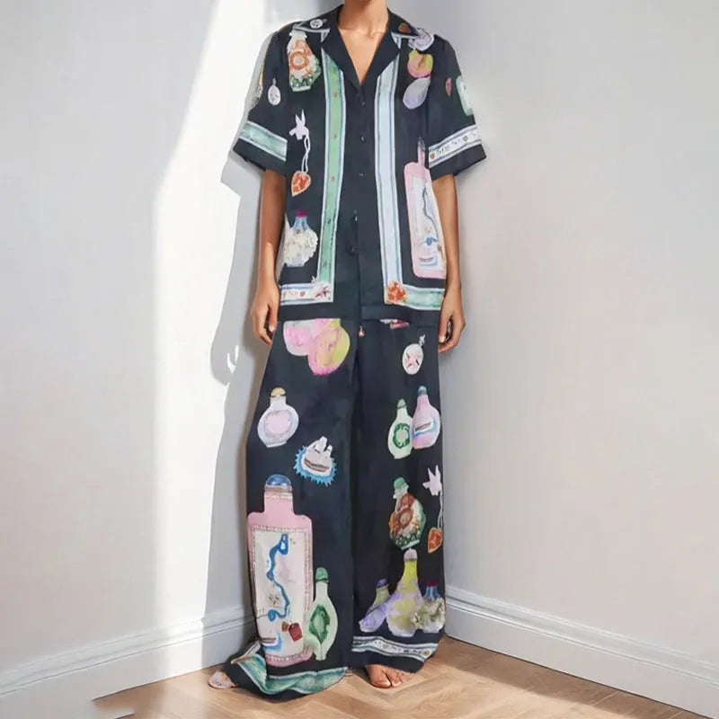 Black women's casual set with cartoon print cardigan top and matching trousers