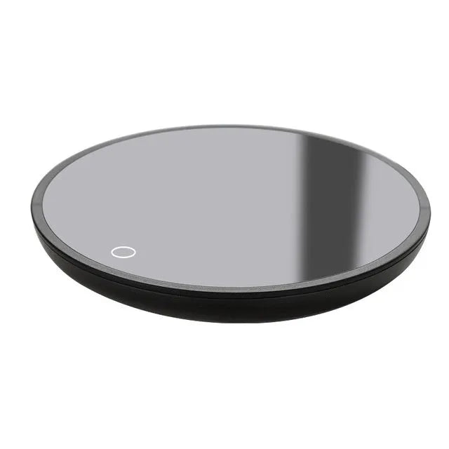 Black coffee mug warmer on a desk with low and high temperature switch