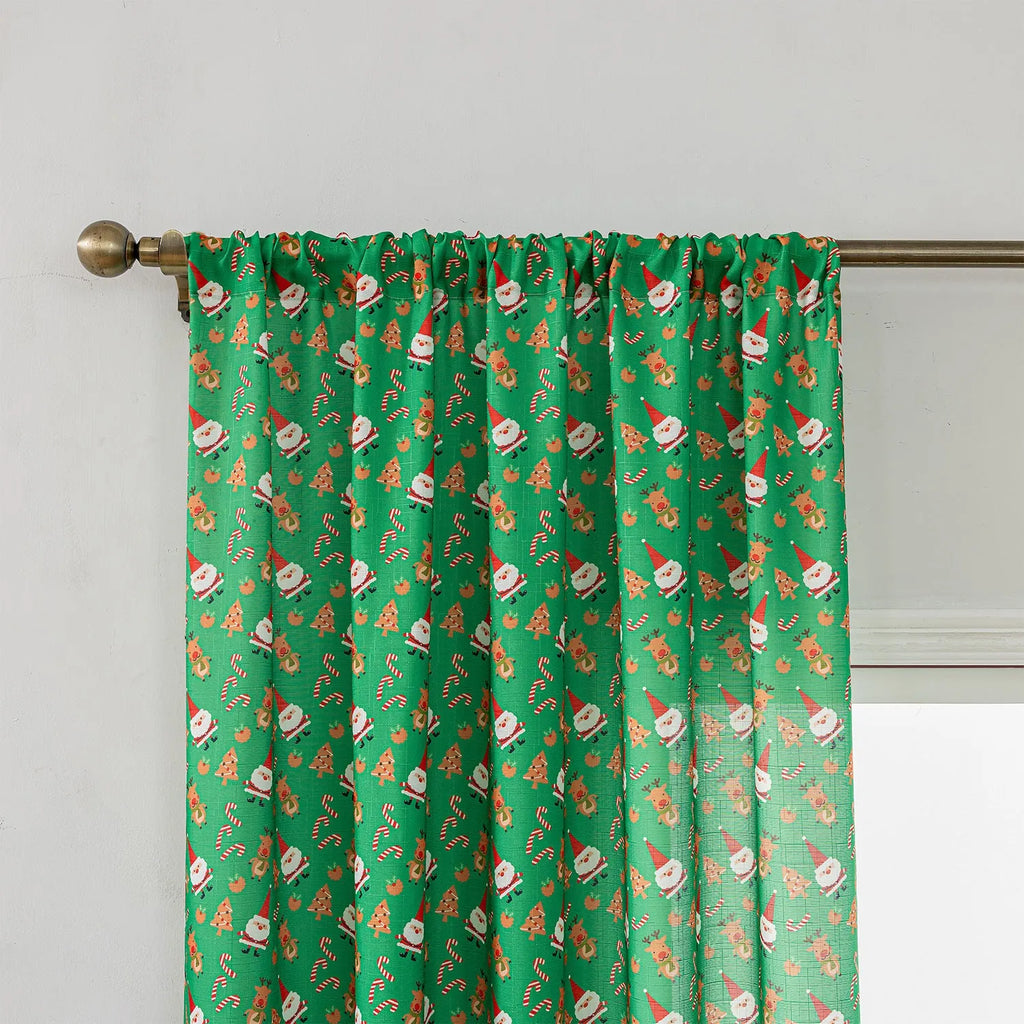 Green Christmas curtain with printed snowman and angel cartoon figures for window decoration
