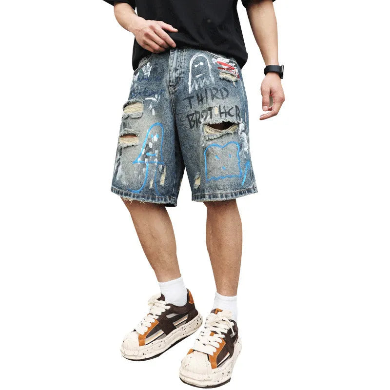 Blue ripped denim jeans shorts for men with graffiti design and straight leg opening.