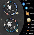 Set of two natural stone beaded bracelets showing zodiac symbols on an adjustable string.