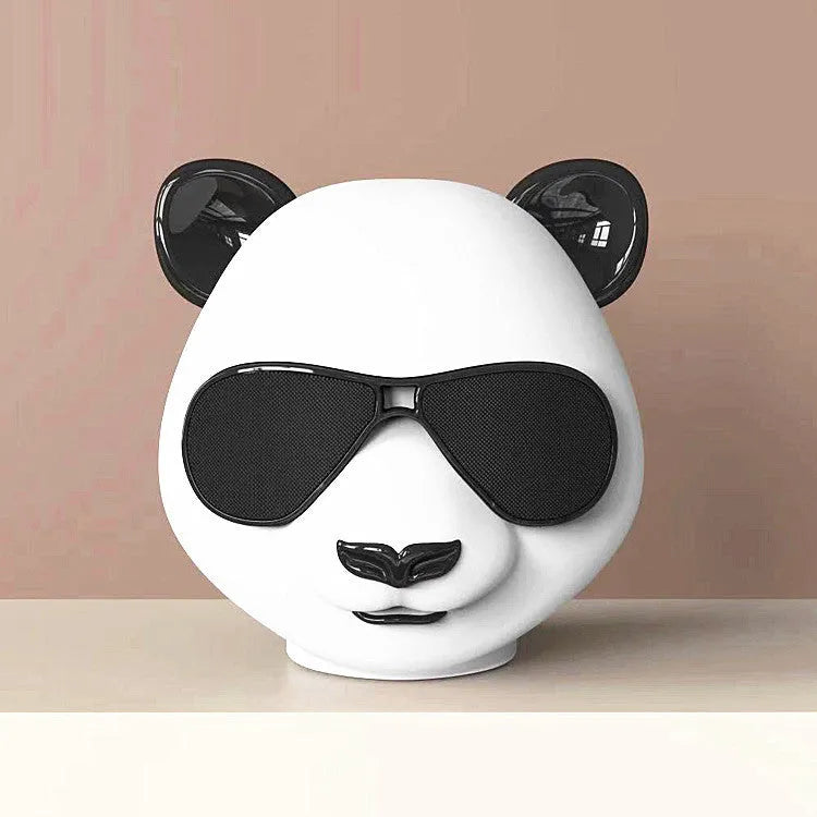 Portable mini classic style Bluetooth speaker showing USB charging port.