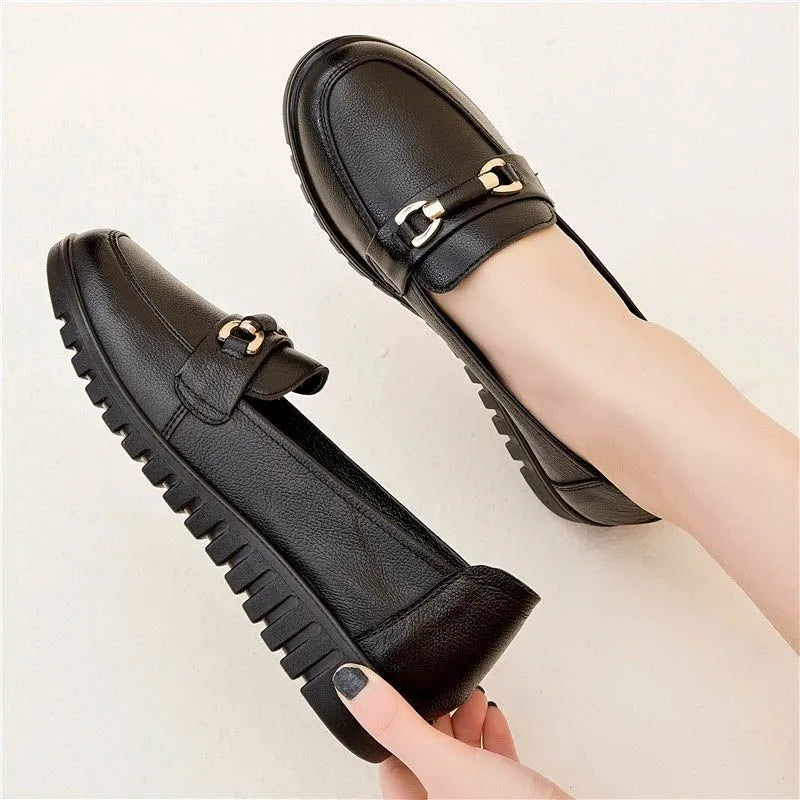 Black women's microfiber slip-on pumps with round toes and low flat heels on rubber soles