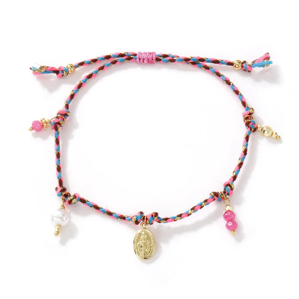 Close-up of a hand-woven colourful braided rope bracelet with an adjustable strap tag closure.