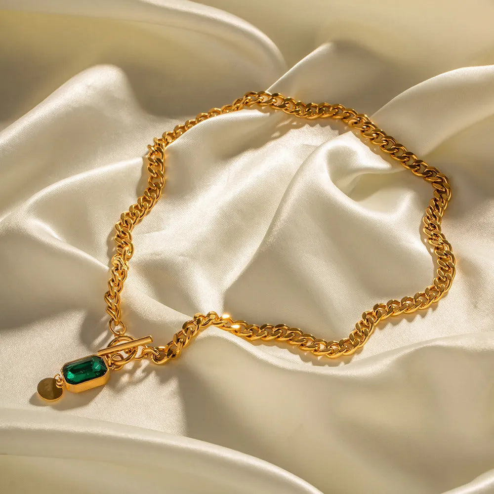 Gold geometric pendant necklace with emerald green zircon on titanium steel Cuban chain