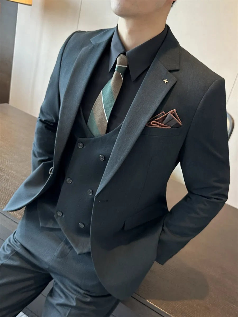 Men's slim fit business suit in a dark green viscose-blend fabric on a hanger.