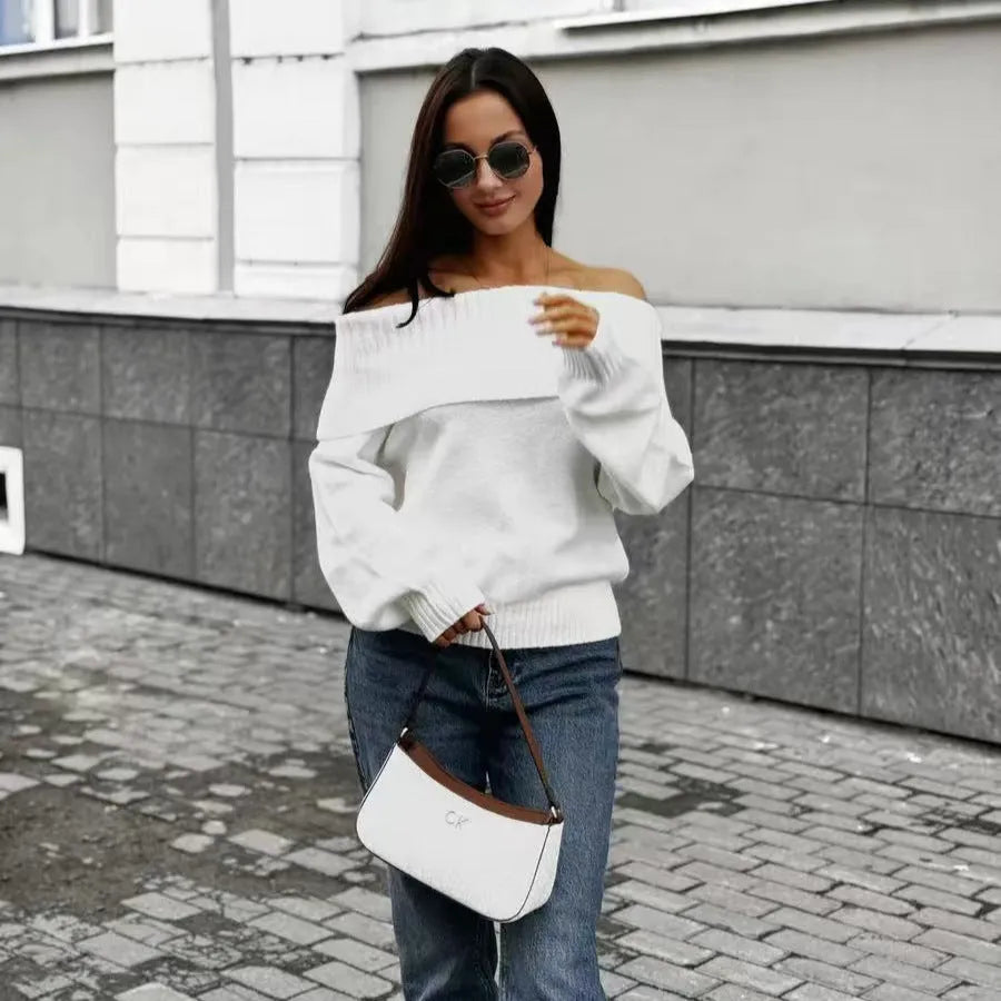 Grey off-the-shoulder sweater with a 3D textured pattern and strapless design.