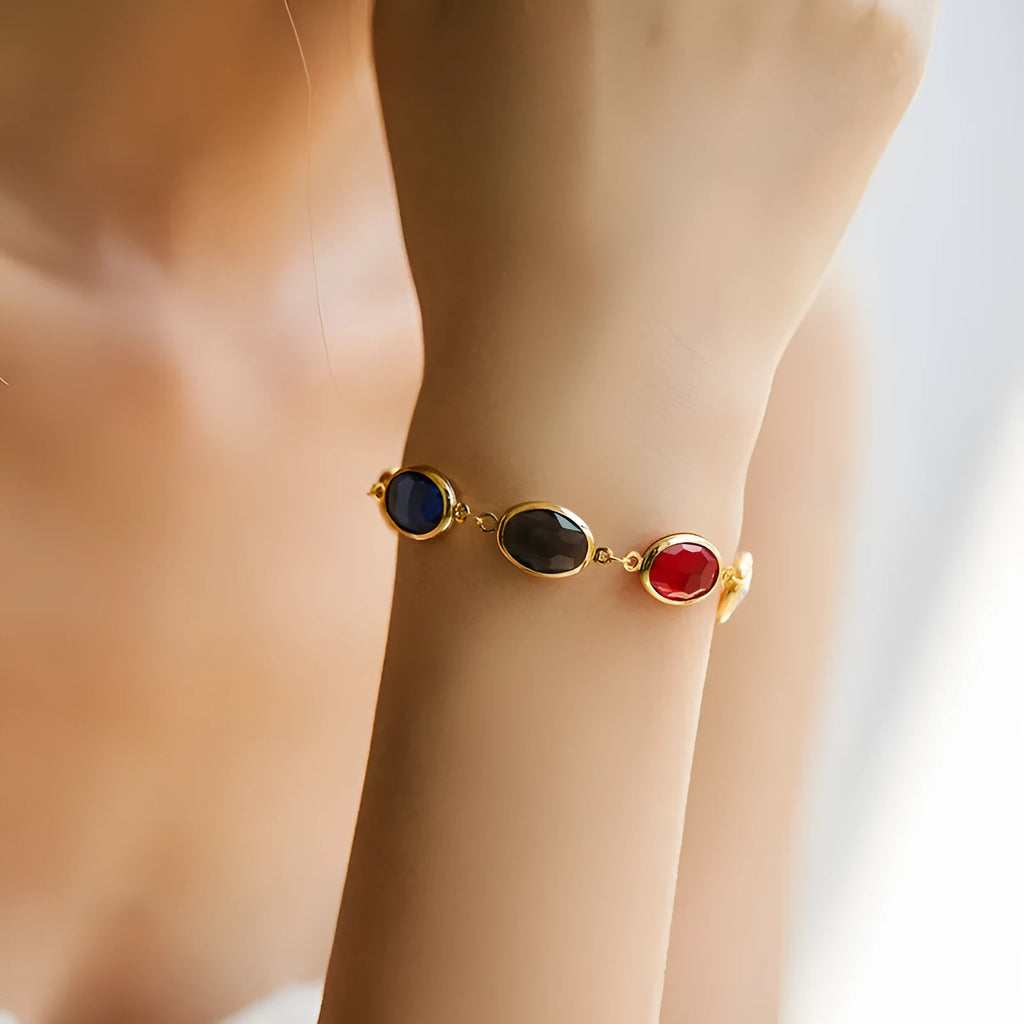 Women's 18K copper geometric ellipse bracelet with blue green multicolor glass inlay detailing