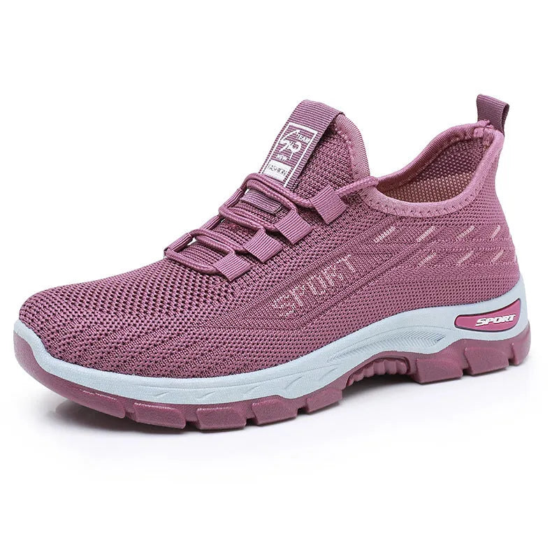 Men's and women's low-top casual sneakers with a round toe and soft PVC sole.