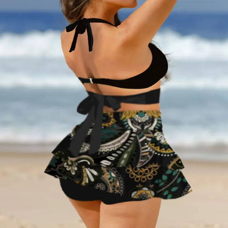 Women's black high-waisted bikini swimsuit with lace-up detail and matching skirt.