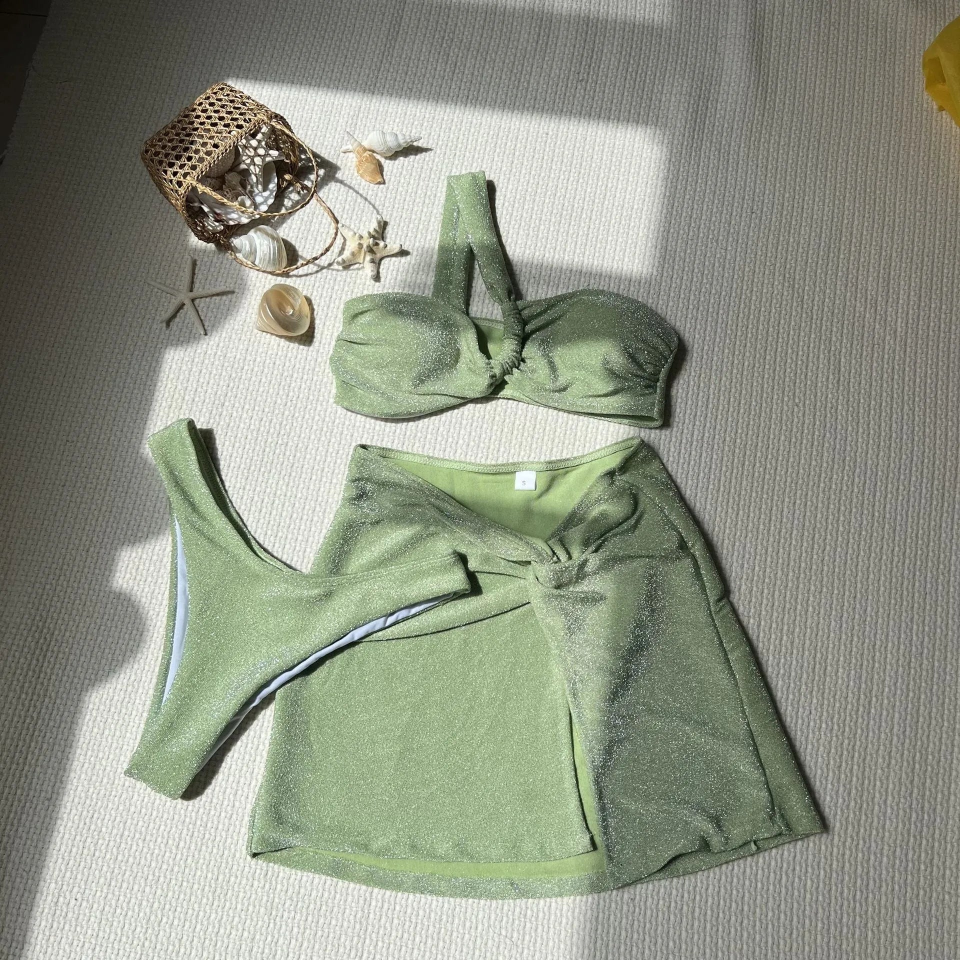 Women's one-shoulder tube top three-piece swimsuit set in glossy polyester with matching skirt