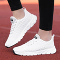 Women's running shoes in black, pink, or white with a detailed fly weaving upper and durable outsole.