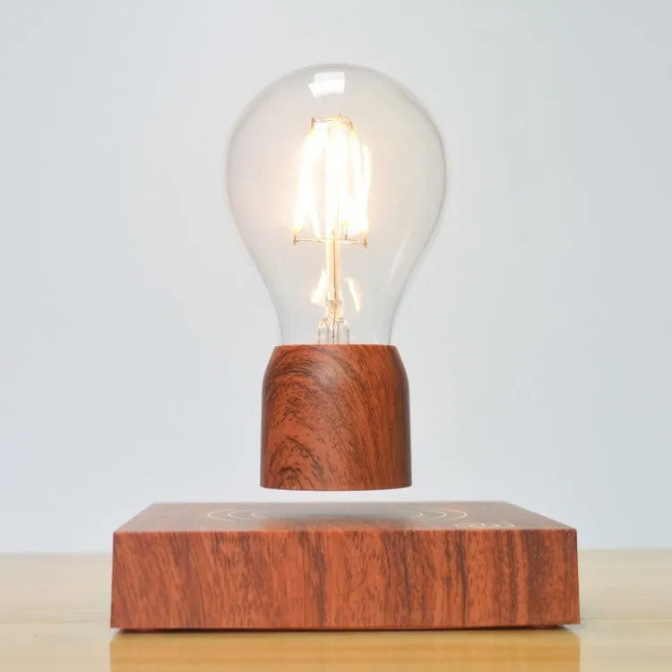 Magnetic levitation floating light bulb hovering above imitation wood base with universal voltage specification