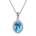 Women's 925 sterling silver jewellery set with blue topaz gemstones showing earrings, ring, pendant, and necklace with geometric pattern