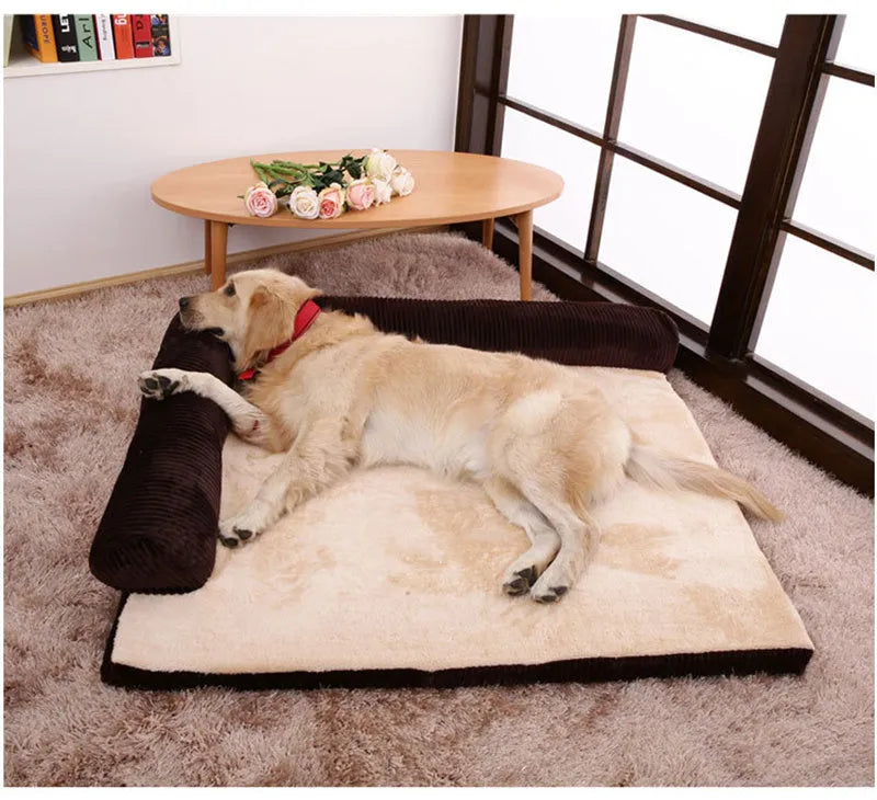 Corduroy dog bed sofa with bolster sides and non-slip base in a neutral colour.