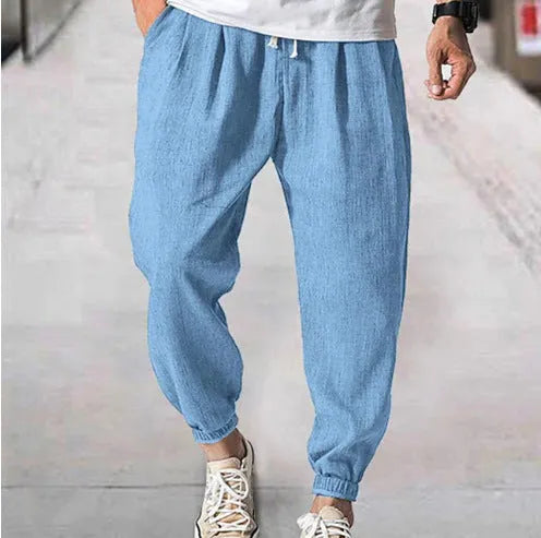 Men's loose cotton summer trousers with banded ankle cuff in light green colour