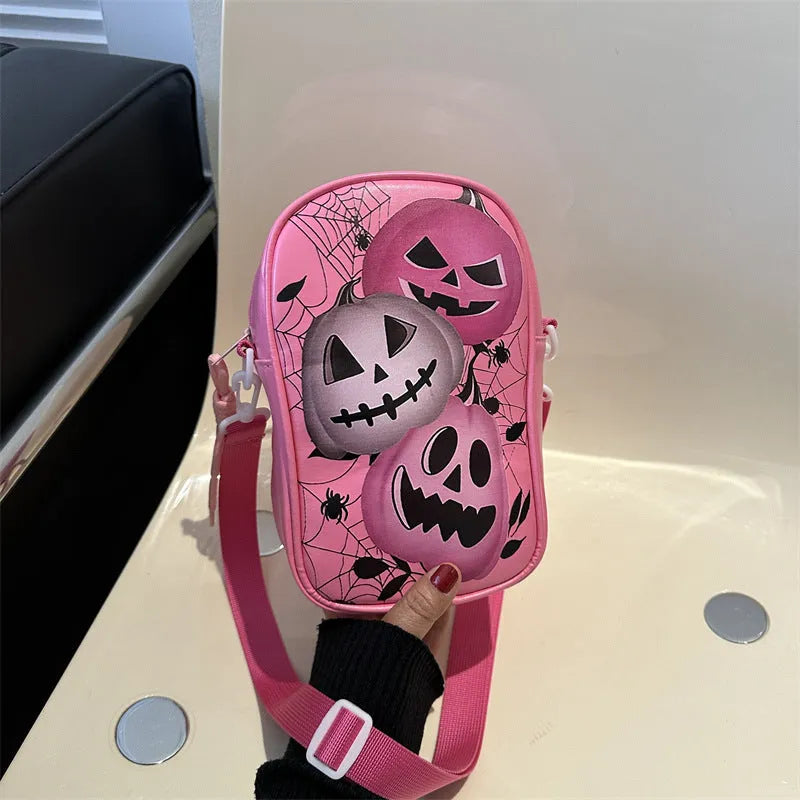 Halloween graffiti print crossbody bag showing pumpkin, ghost and bat designs in medium 14x23x9.5cm size