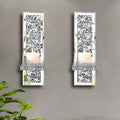 Pair of silver mirror glass wall hanging candle holders measuring 10x11x38 cm