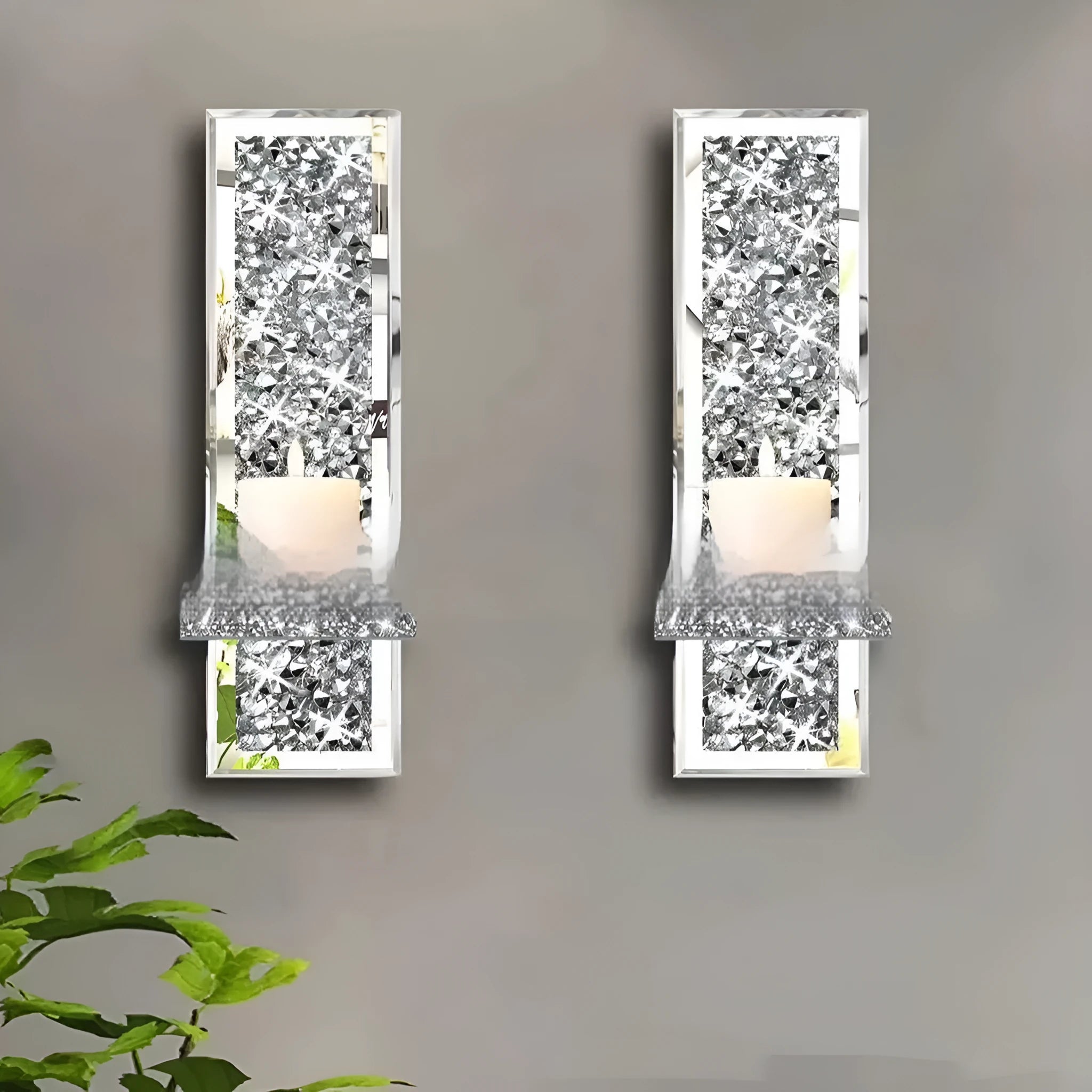 Pair of silver mirror glass wall hanging candle holders measuring 10x11x38 cm
