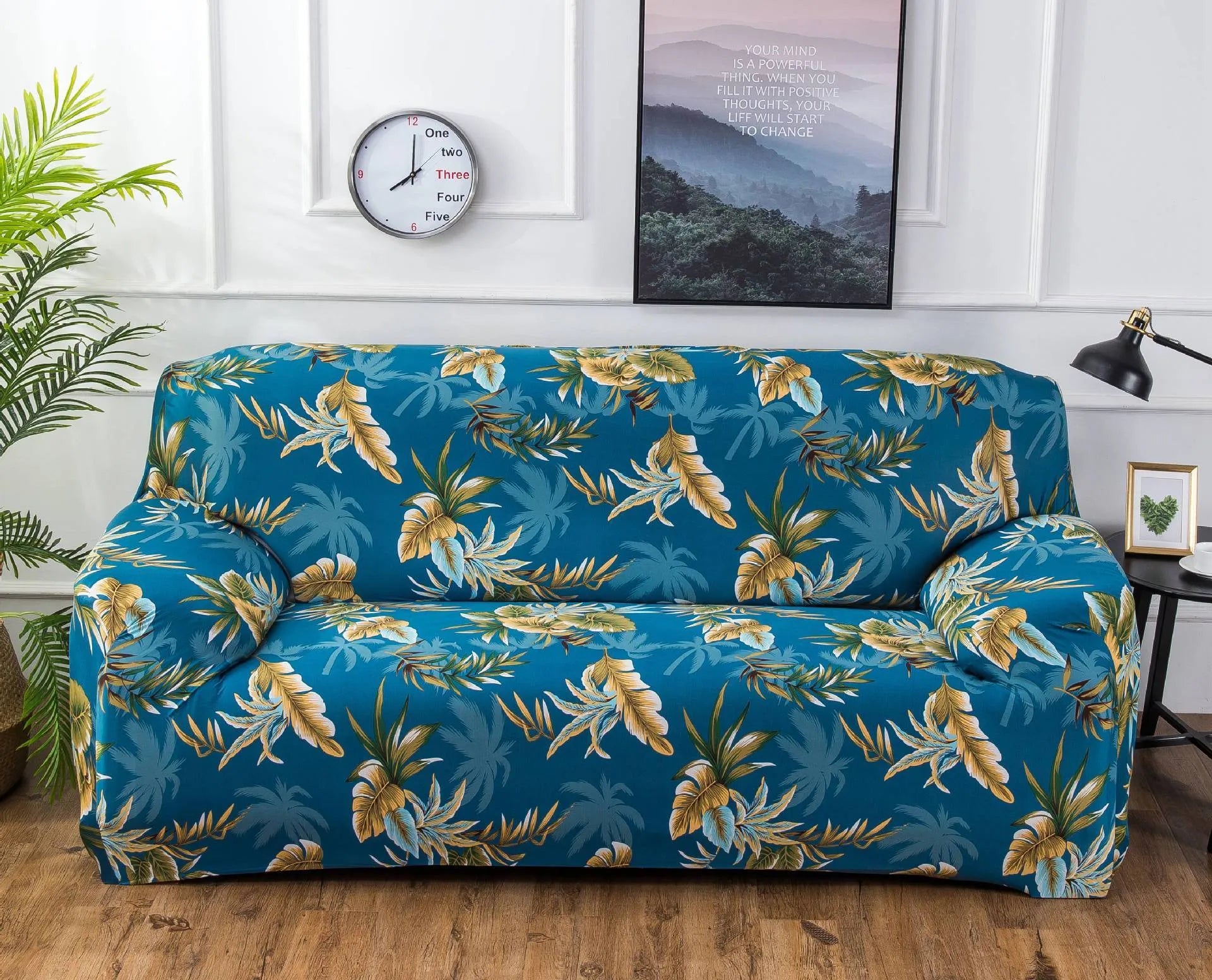 Printed stretch sofa cover with geometric pattern on three-seater sofa
