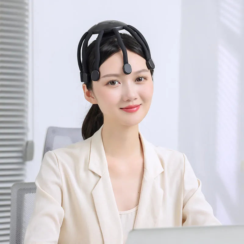 Black USB-powered head massager with multiple claws for scalp vibration and relaxation